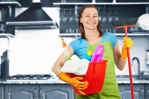High-touch office surfaces being sanitised by a professional cleaner