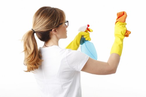 Employee carrying out cleaning duties in a safe and controlled way