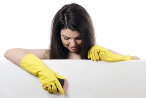 Trained cleaner using appropriate products during a service visit